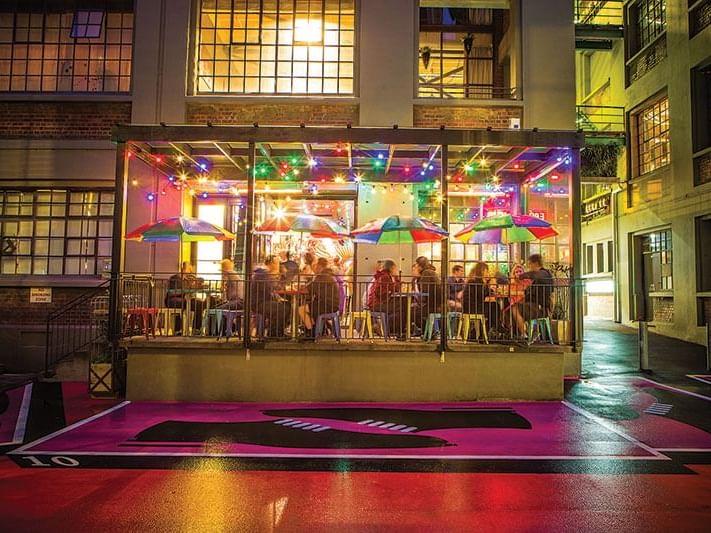 Hannah's Laneway, a narrow city walkway lined with hospitality frontages and printed posters